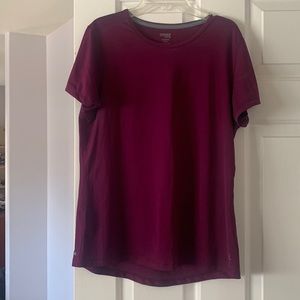 Danskin Now purple semi-fitted leisure wear top.